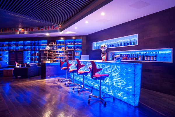 Nightclub bar with blue LED lit counter front and backlit bottle shelves - CL Lighting bar case