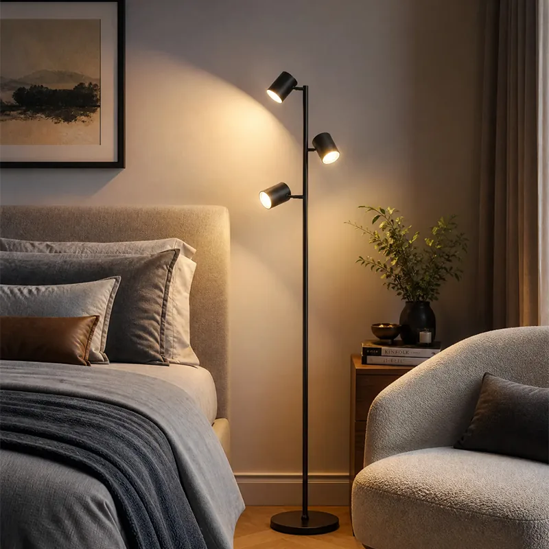 Warm white CCT lighting from the 3-head smart floor lamp in a bedroom